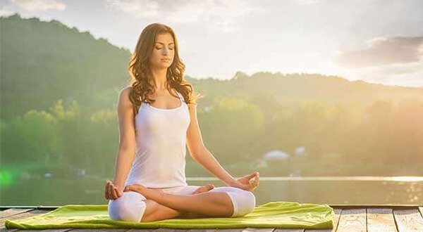 Women practicing yoga poses for health and wellness